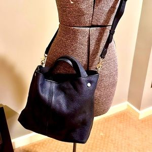 Vince Camuto black leather hand bag.